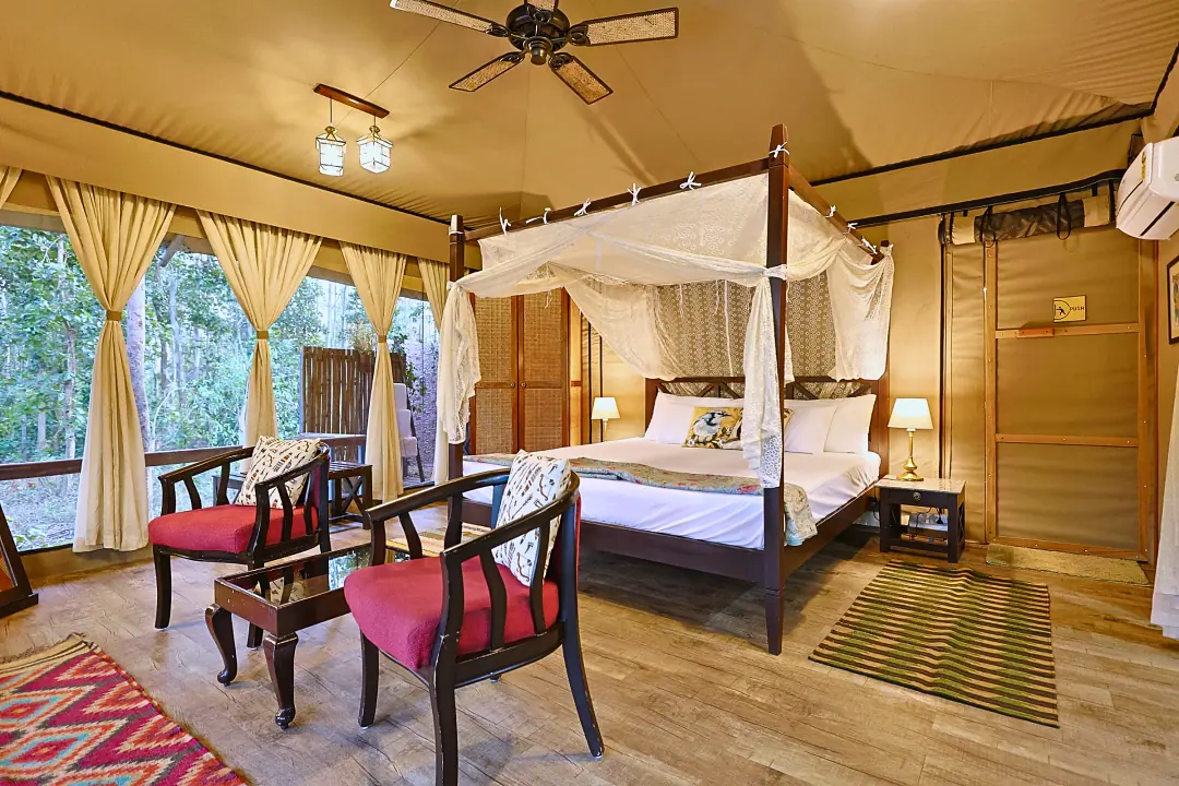 A four-poster bed with net drapes in the King's Tent